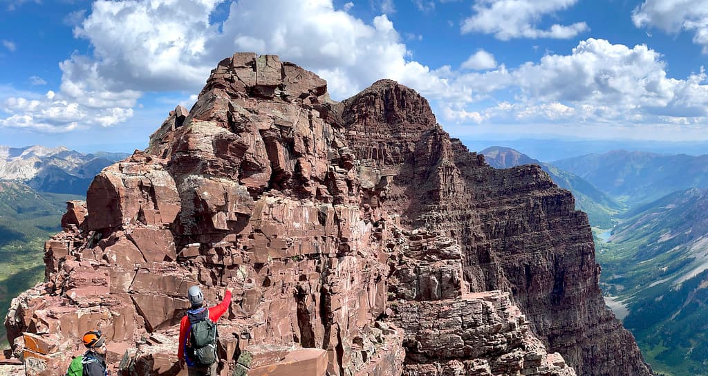 Comparing options for the third spire, North Maroon’s summit visible beyond this set of obstacles.